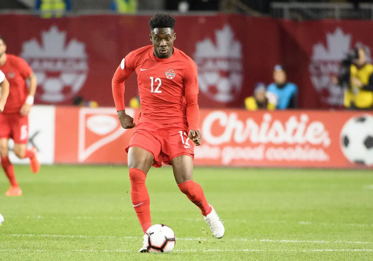 Oct 15, 2019; Toronto, Ontario, CAN; Canada midfielder Alphonso Davies (12) controls a ball during the first half of a CONCACAF Nations League soccer match against the USA at BMO Field. Mandatory Credit: Nick Turchiaro-USA TODAY Sports

