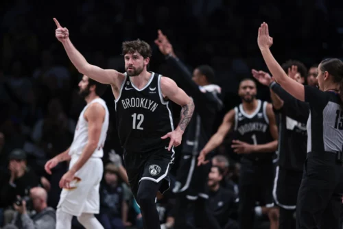 
Mar 21, 2023; Brooklyn, New York, USA; Brooklyn Nets forward Joe Harris (12) reacts after a three-point basket against the Cleveland Cavaliers during the first half at Barclays Center. Mandatory Credit: Vincent Carchietta-USA TODAY Sports
